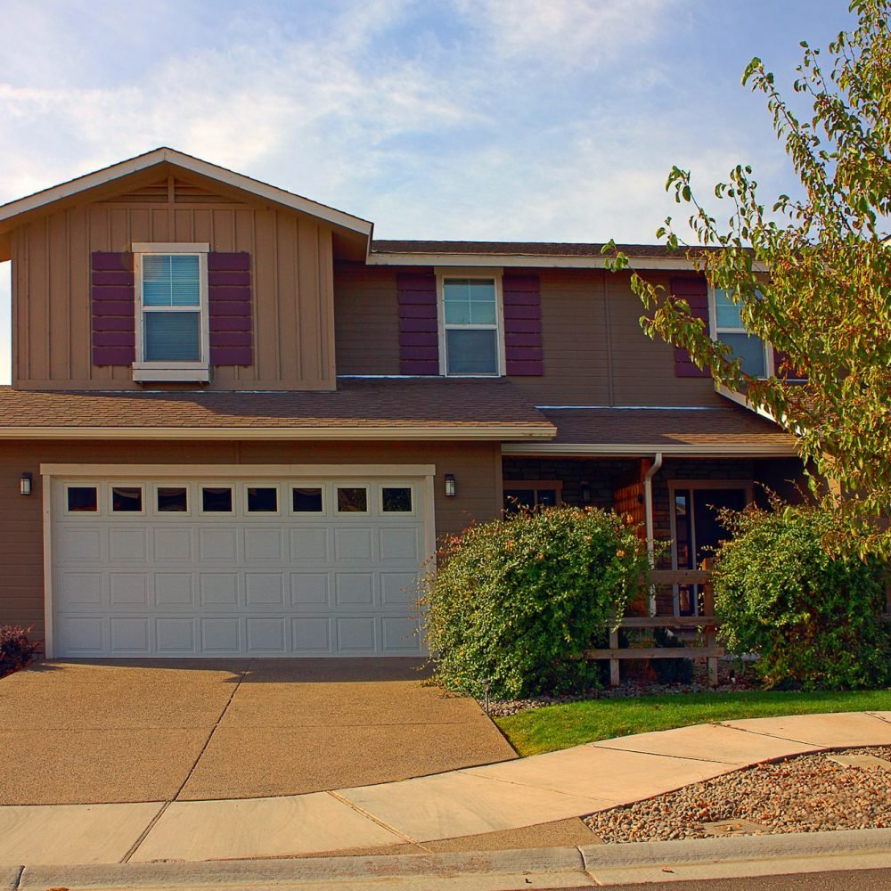 House and driveway in suburban neighborhood